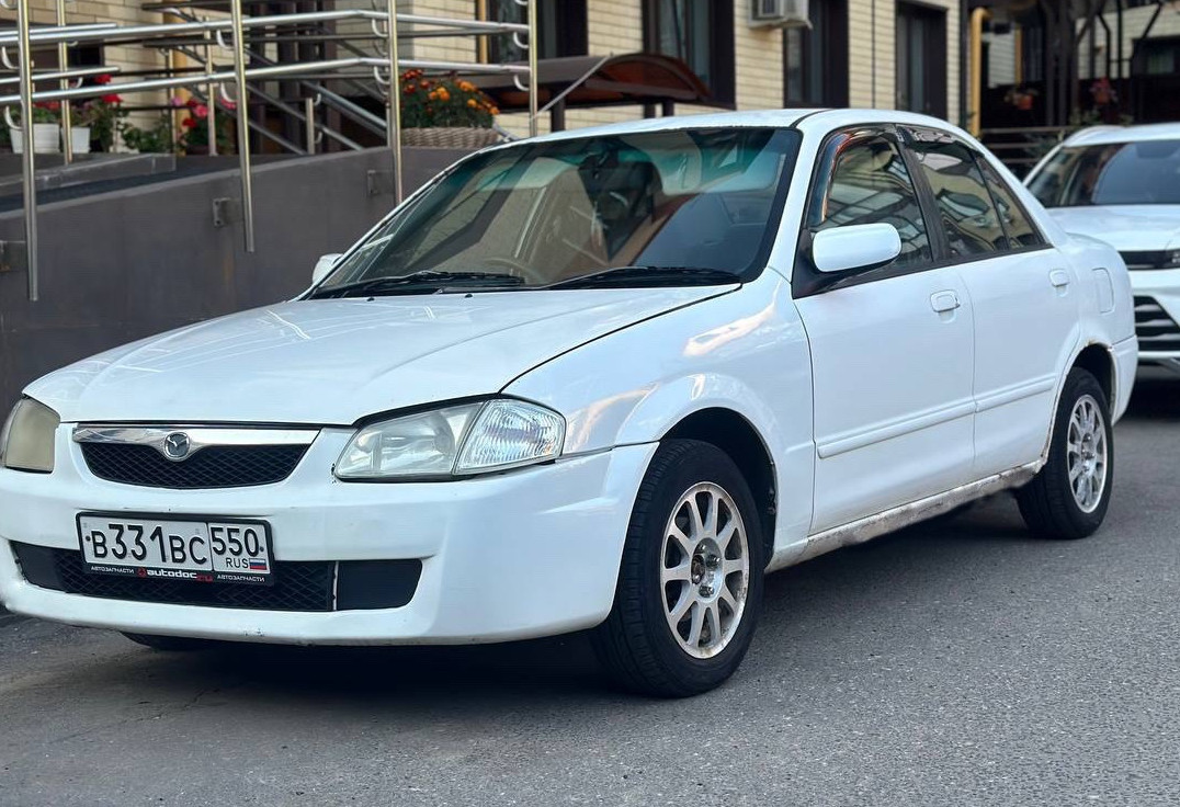 Аренда mazda familia эконом класса 2000 года в городе Москва Планерная от 750 руб./сутки, задний привод, двигатель: бензин, объем 1.5 литров, без водителя, недорого, вид 2 - RentRide