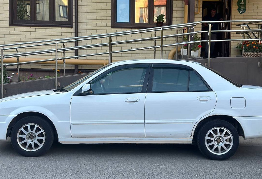 Аренда mazda familia эконом класса 2000 года в городе Москва Планерная от 750 руб./сутки, задний привод, двигатель: бензин, объем 1.5 литров, без водителя, недорого, вид 3 - RentRide