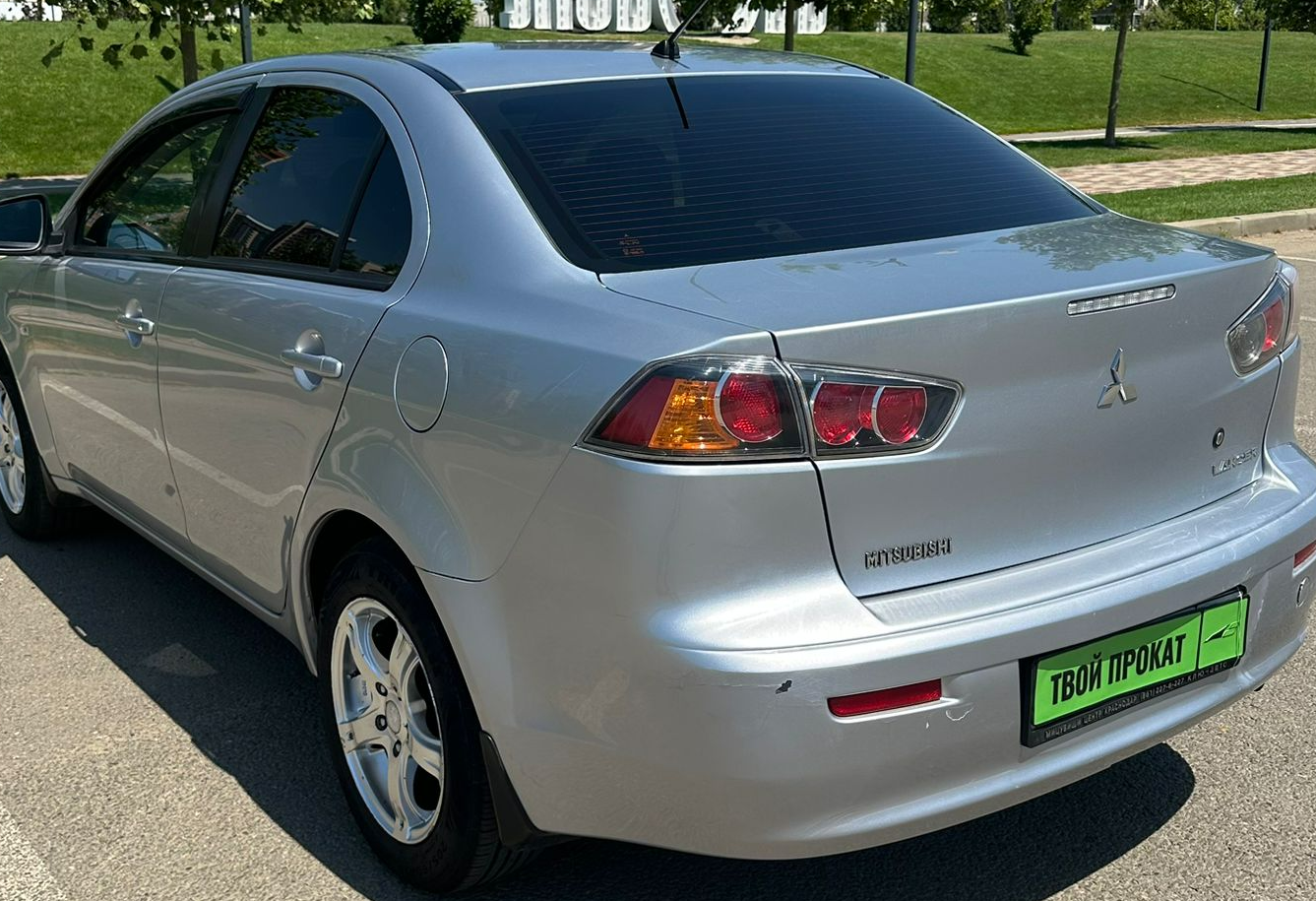 Аренда mitsubishi lancer эконом класса 2010 года в городе Москва от 2320 руб./сутки, передний привод, двигатель: бензин, объем 1.5 литров, ОСАГО (Мультидрайв), без водителя, недорого, вид 3 - RentRide